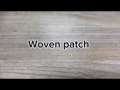 La broderie faite sur commande en gros raccorde le fer sur les corrections tissées pour l'habillement