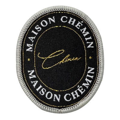 Les corrections tissées faites sur commande de tissu noir cousent sur la correction tissée de label pour des vêtements de vestes de Letterman