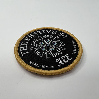 La broderie de fête de rond de Brown raccorde le fer de Flowsnake de frontière de Merrow sur les corrections tissées