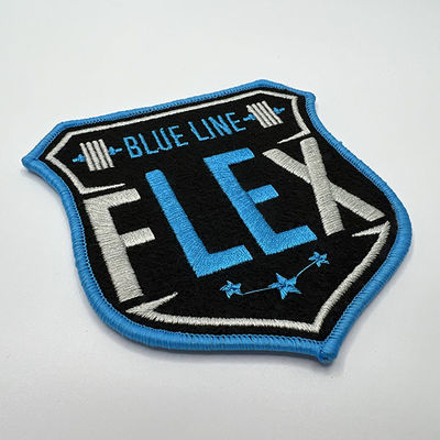 Le sergé de Logo Iron On Embroidered Patches a jugé que la frontière de Merrow de tissu/laser a coupé la frontière