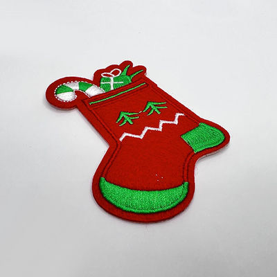 Le cadeau de Noël cogne le fer senti lavable brodé fait sur commande de tissu de corrections sur le support