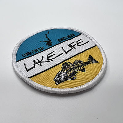 La broderie faite sur commande de la vie de lac raccorde le fer d'OEM sur la correction tissée pour l'habillement de chemise