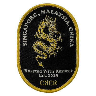 Frontière adhésive adaptée aux besoins du client de Dragon Embroidery Patches Shrink Proof Merrow de fonte
