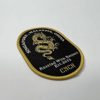 Frontière adhésive adaptée aux besoins du client de Dragon Embroidery Patches Shrink Proof Merrow de fonte